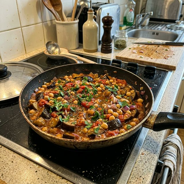 Vegan Mediterranean aubergine and tomato pan with chickpeas
