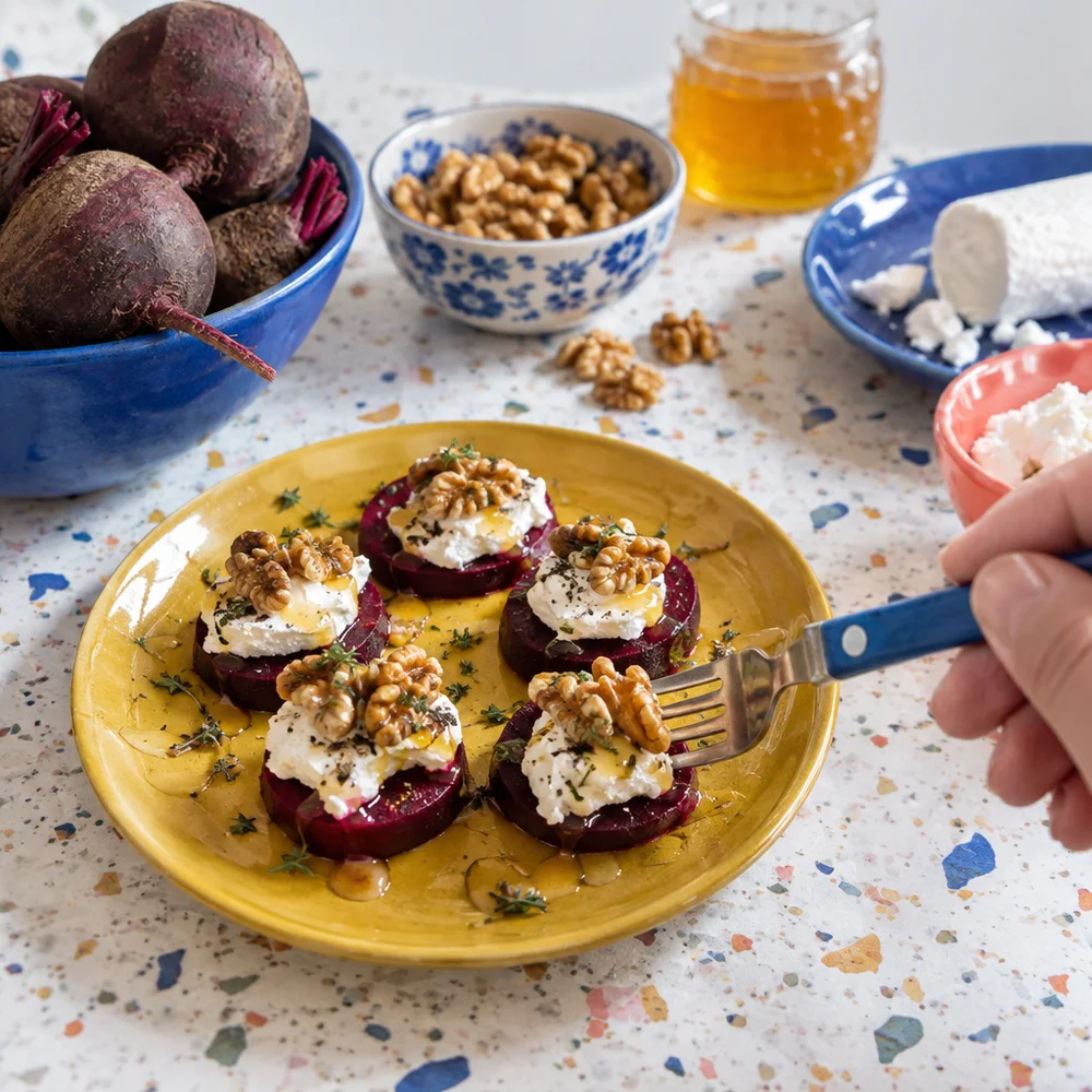 Gluten-free beetroot bites with soft goat's cheese and walnuts