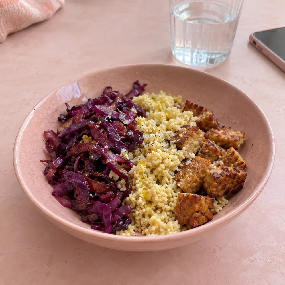Meal prep bowl with roasted red cabbage, millet and tempeh