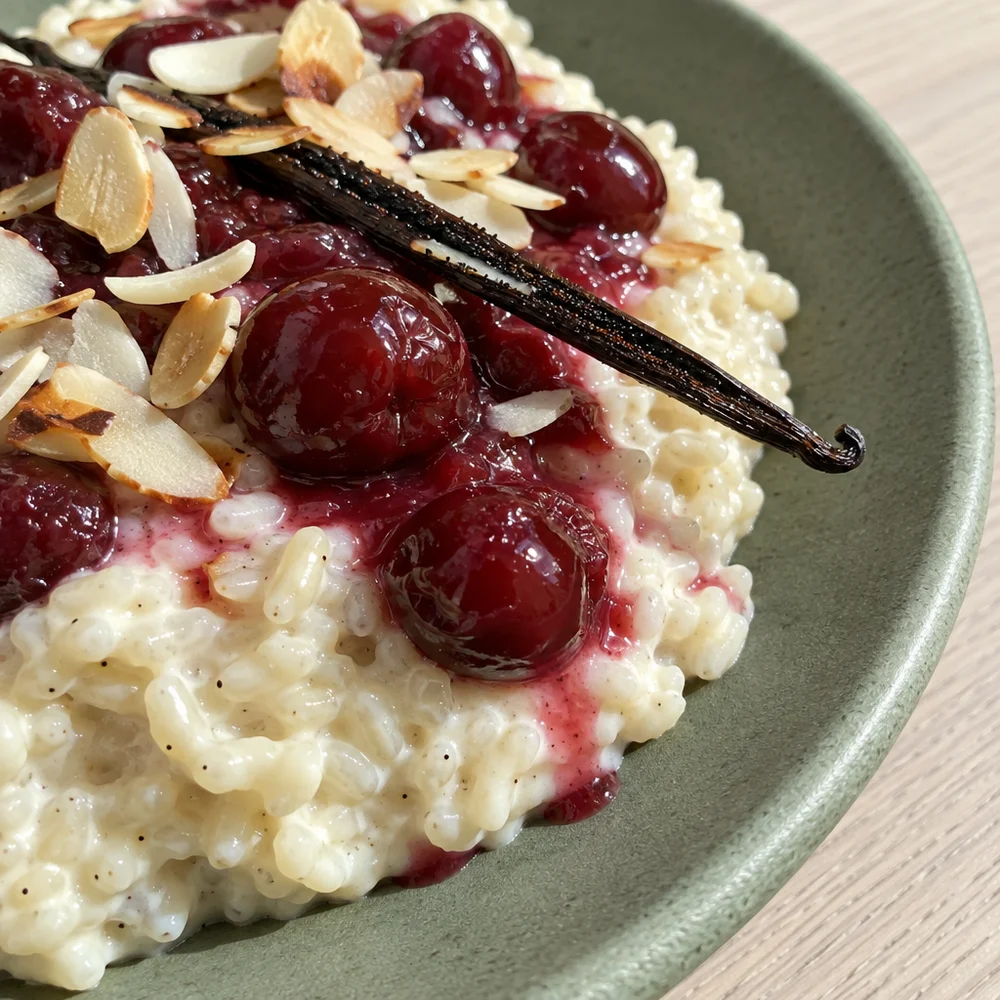Vegan almond rice pudding with cherries for Christmas breakfast