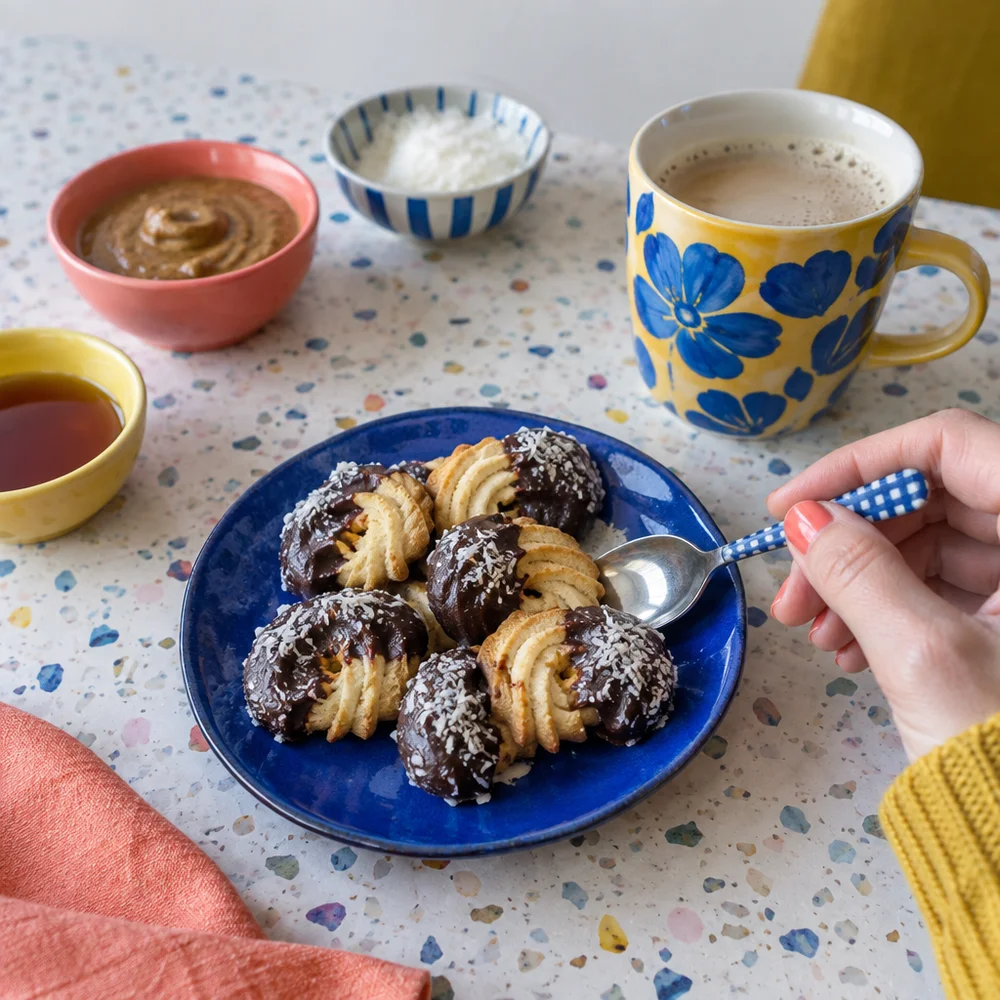 Vegan Spritzgebäck (piped butter cookies) with almond butter and cocoa glaze